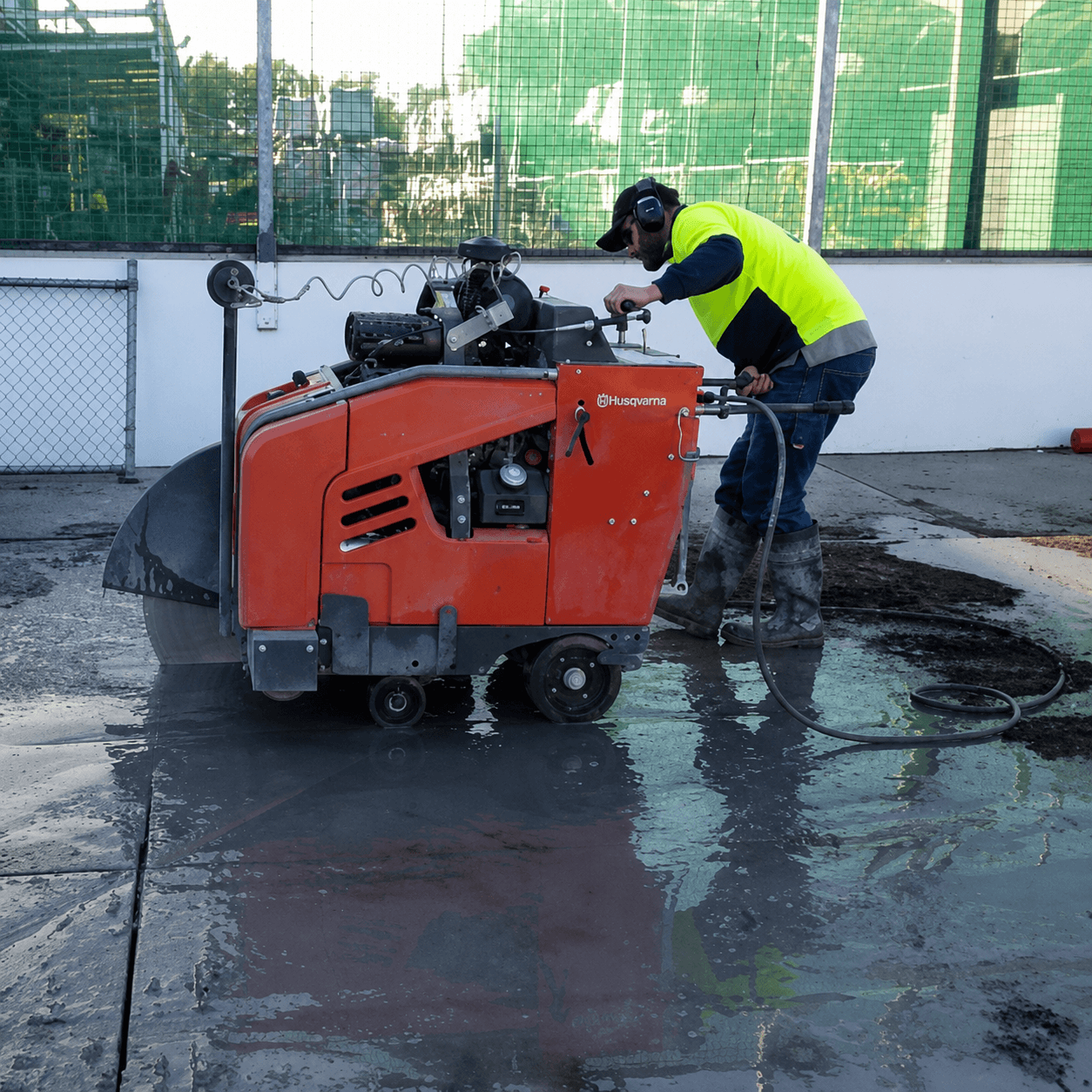 Concrete slab cutting equipment being operated by our team.
