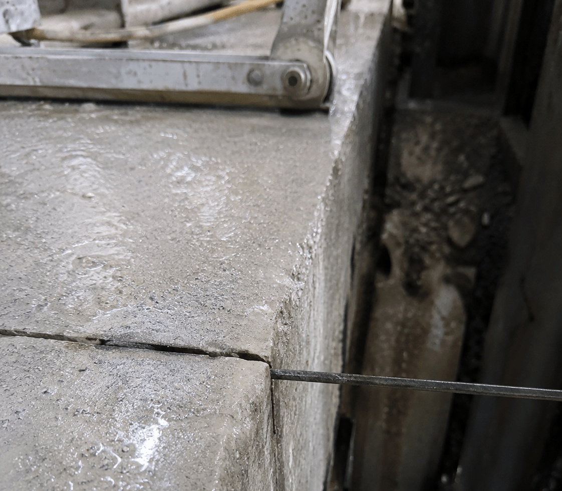 Wire sawing through concrete slab.